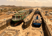 Two container ships, Evergreen and Cosco Shipping, navigating adjacent locks at the Panama Canal